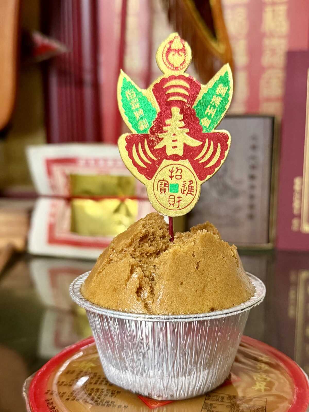 A homemade 發糕 cake sitting by the new year alter