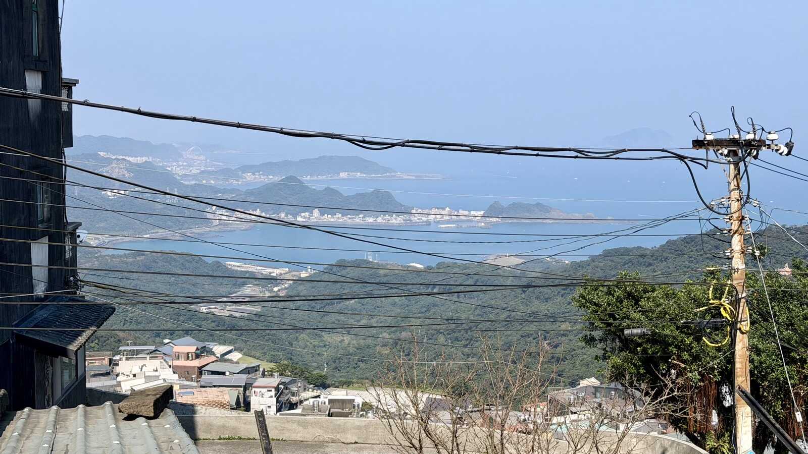 Looking out towards the sea, through many utility lines